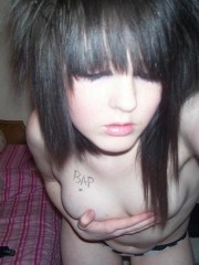 Redhead tattooed slut strips